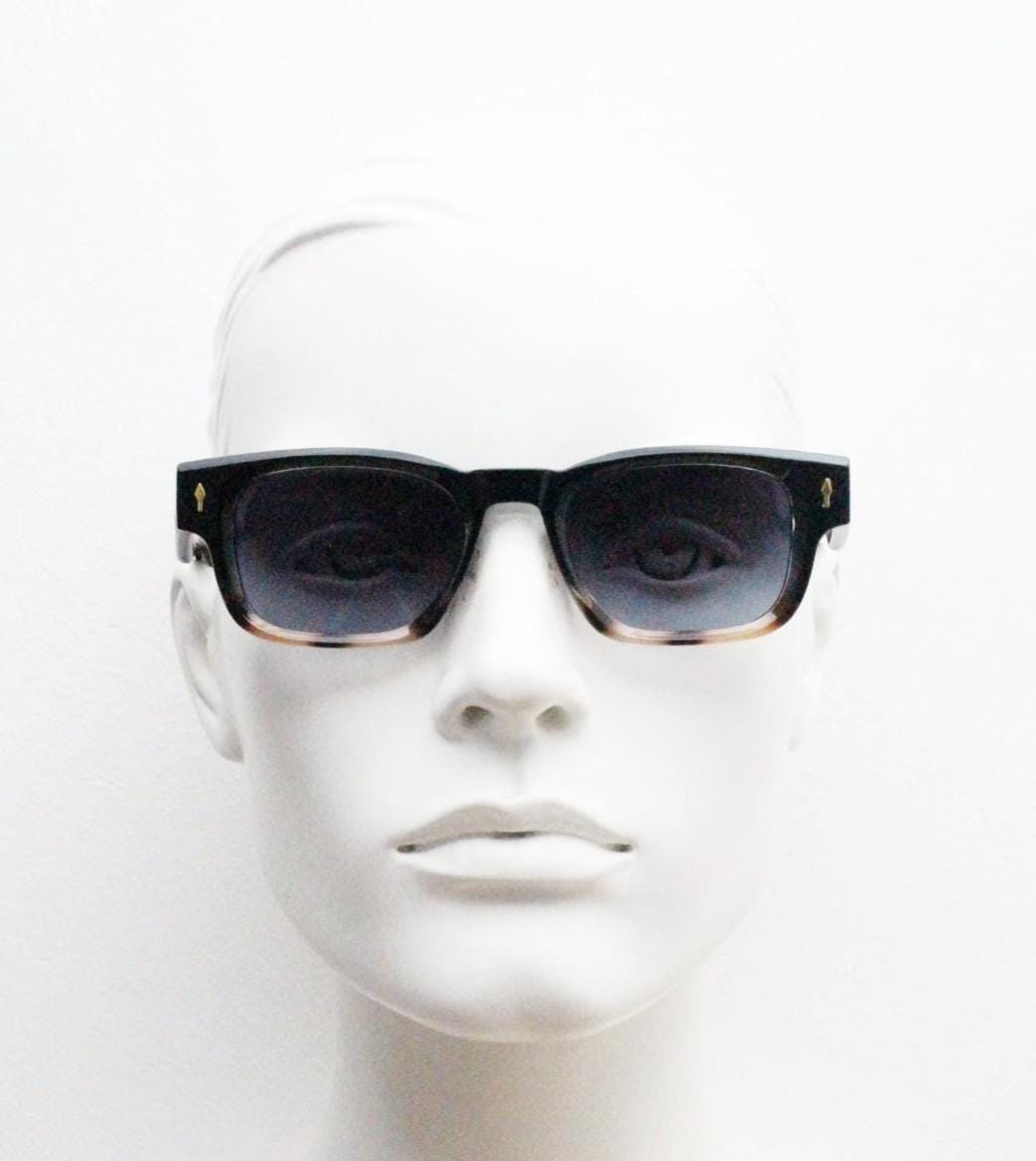 Vintage 90s low profile thick frame sunglasses. Black and tortoise ombre frame with graduating grey lenses. Unused NOS. One off sample
