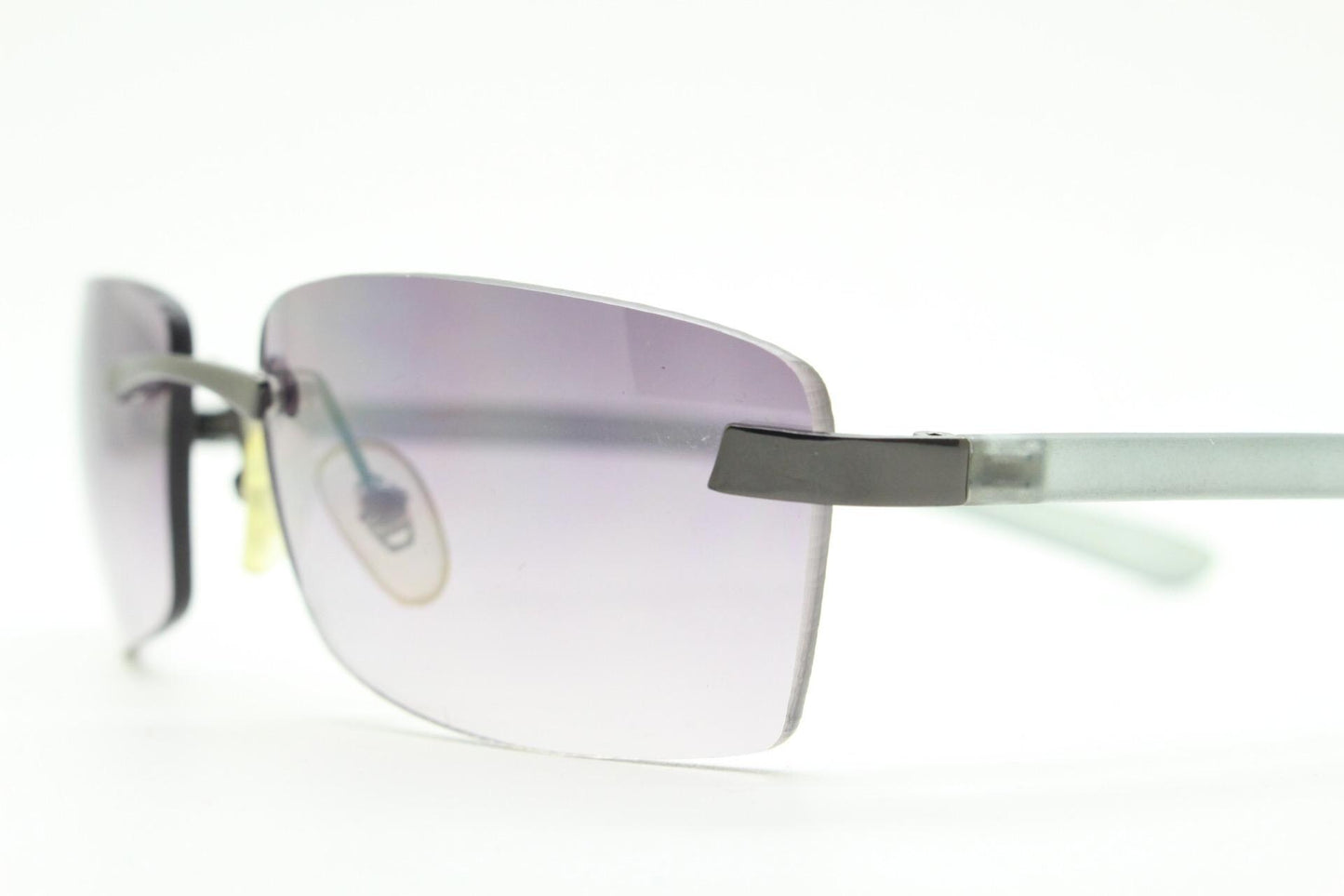 90s vintage minimal frameless sunglasses. Minimal mulberry rectangular lenses with gunmetal grey trim and frosted arms. Matrix shades