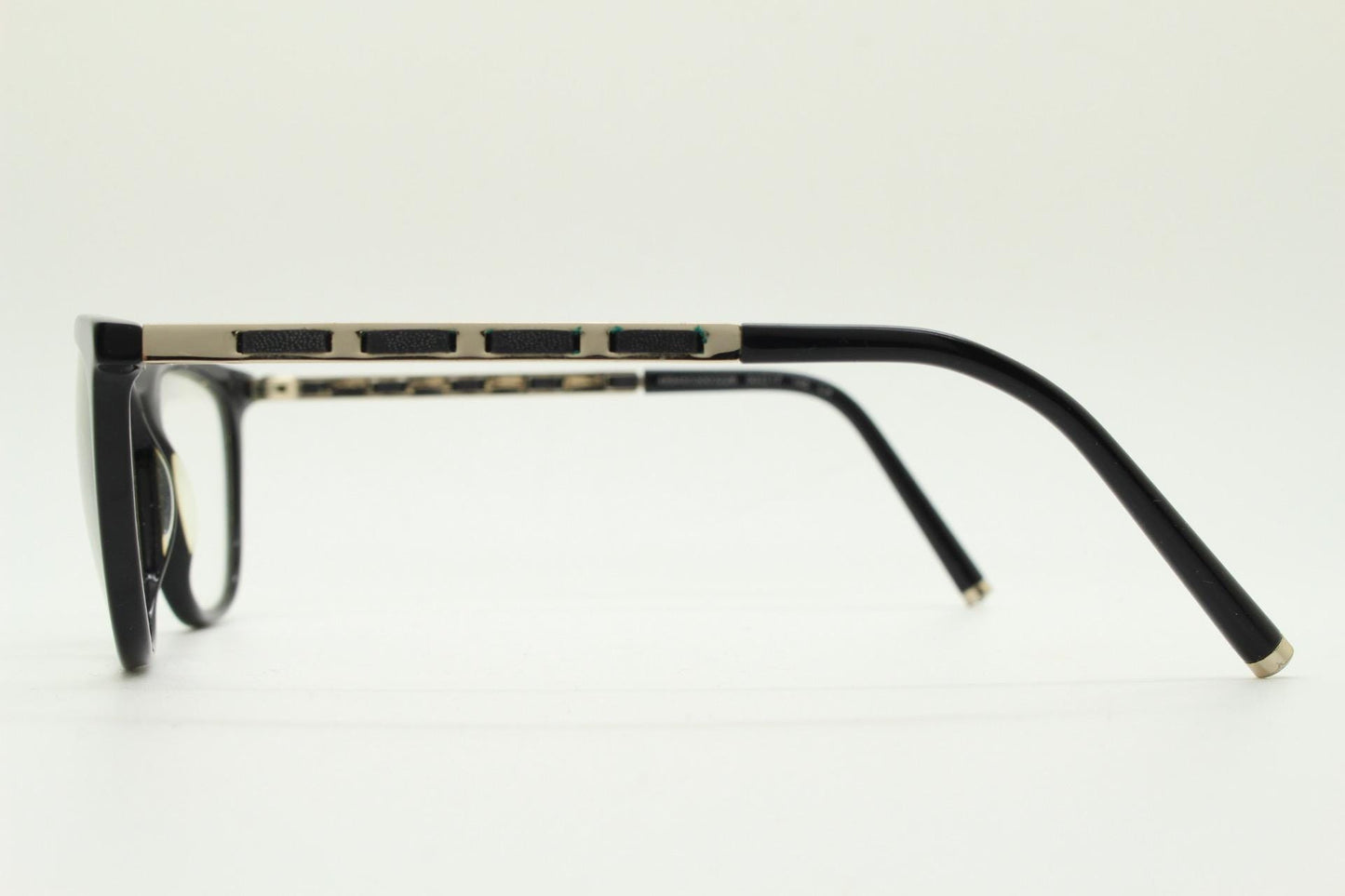 Vintage elegant cat eye glasses by Heritage. Black gloss acetate optical frames with leather lattice arms. Prescription RX cateye spectacles