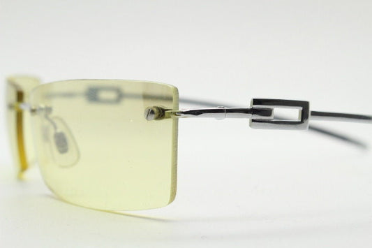 Y2K vintage rectangular sunglasses. Minimal frameless light tone curved mirrored lenses with silver chrome trim. 2000's. 90s. 00s. NOS