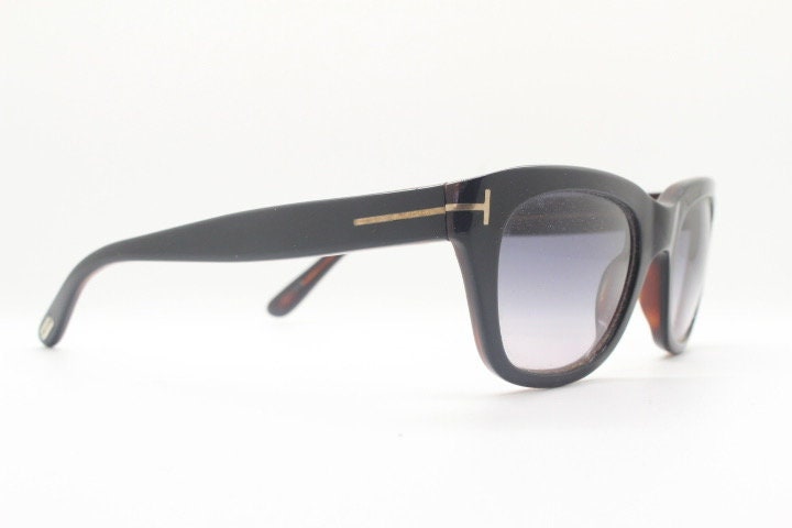 Tom Ford vintage modified wayfarer sunglasses made in Italy. Slightly cat eye form in black gloss acetate with superb graduating lenses
