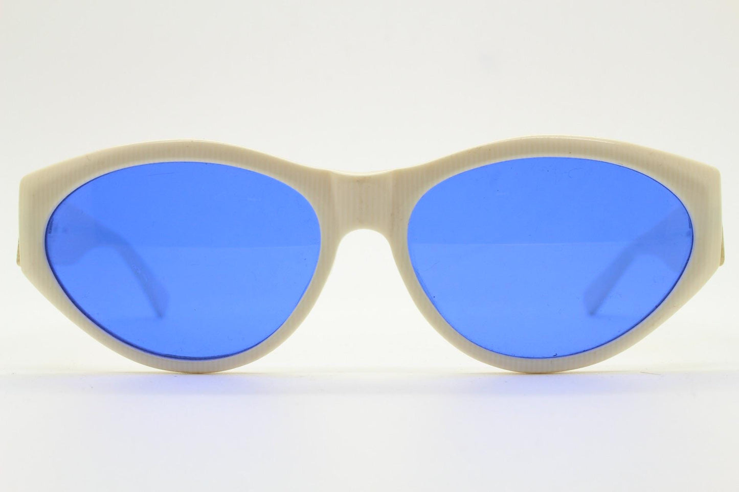 Benson and Ashley vintage 80s cat eye sunglasses hand made in England. 50s design white acetate cateye frame with cobalt blue lenses. NOS