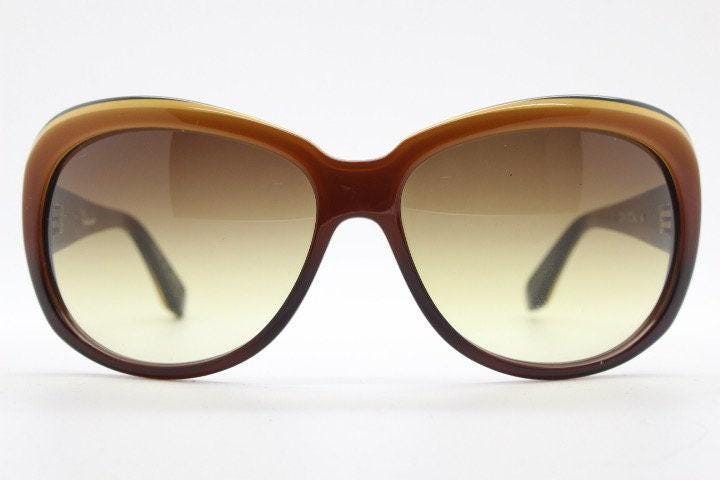 Dita oversized 70s design sunglasses model Pretender made in Japan. Gorgeous brown and black layered acetate. Womens NOS. 60s