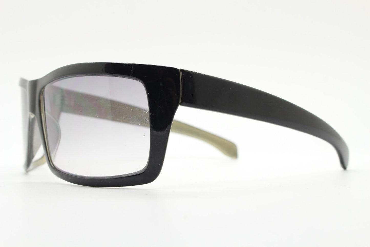 Y2k vintage wrap around large rectangular sunglasses. Curved black gloss frame with tasteful graduating lenses. 2000's NOS