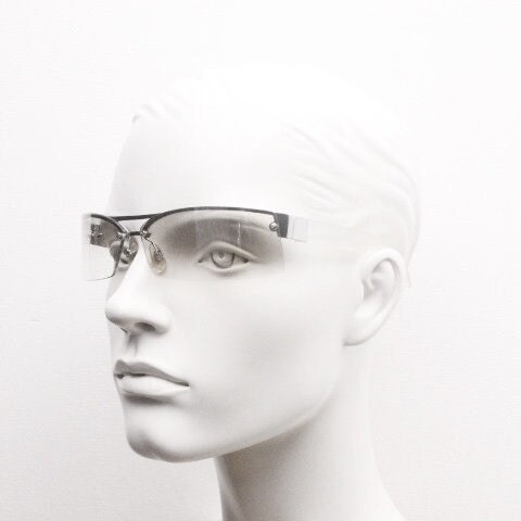 Y2K vintage wraparound sunglasses. Sick fashion grail half frame in silver chrome with extra light tone curving mirrored lenses. 2000's NOS