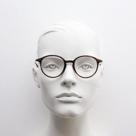 Giorgio Armani eye glasses model 7124 made in Italy. Mottled brown acetate optical frames with flat metal arms. Prescription eyeglasses. RX