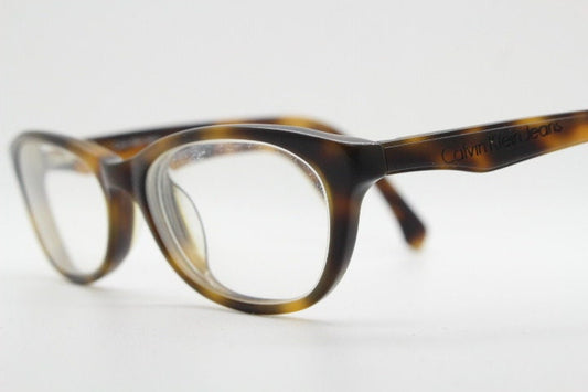 Calvin Klein Jeans modified cat eye glasses model CKJ918. Tortoise gloss low profile acetate optical frames. Prescription eyeglasses. RX
