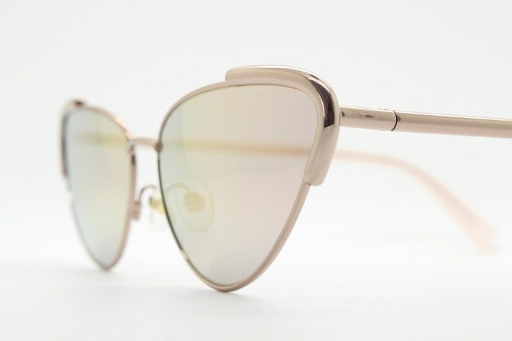 Rebecca Minkoff futuristic golden oval cat eye sunglasses. Women's rose gold metal cateye frame with sunburst mirror lenses. NOS