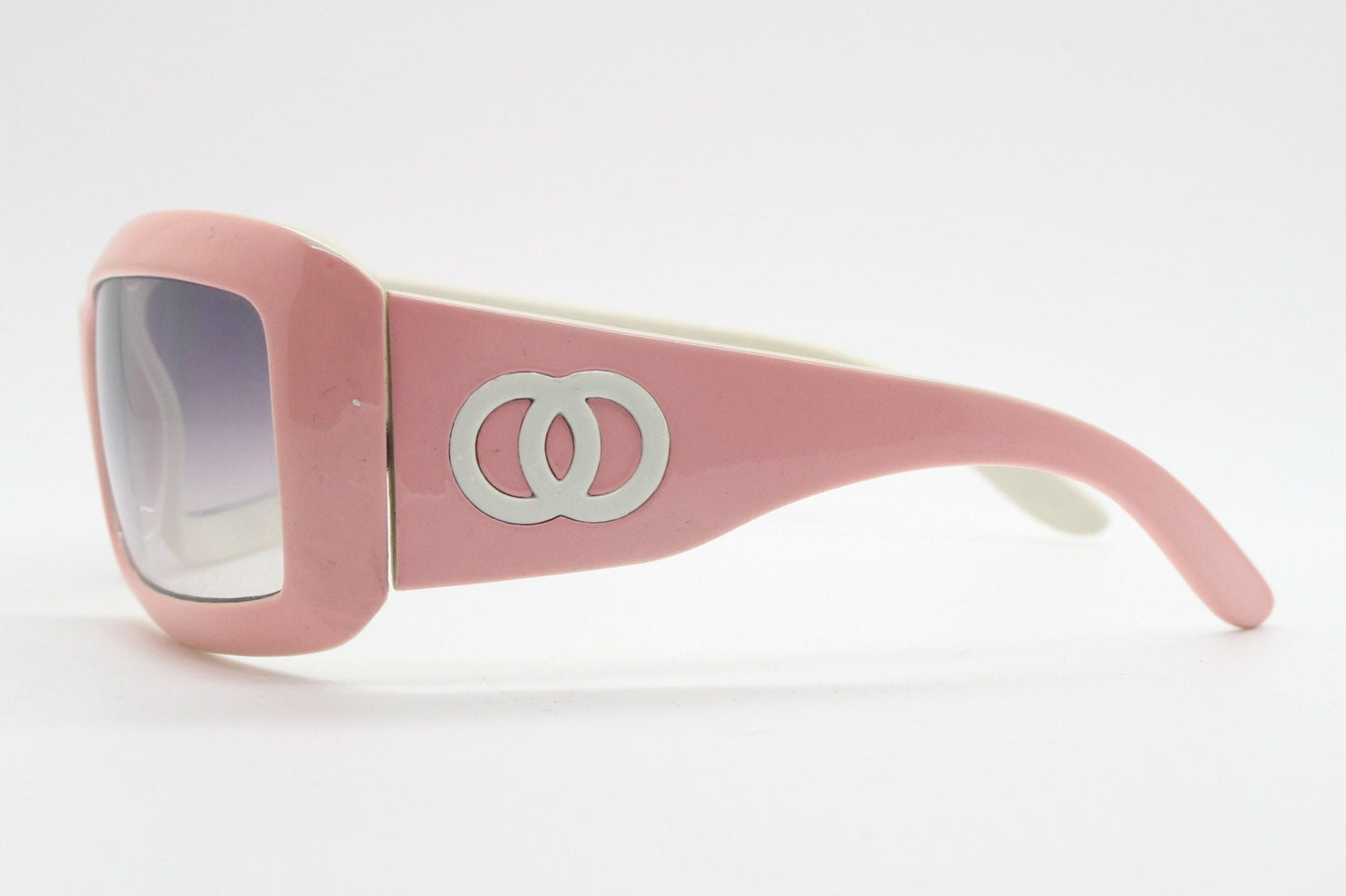 Y2k vintage rectangular wrap around bug eye sunglasses. Curving pink frame with big chain link logo. Rave shield fashion grail. 2000s NOS