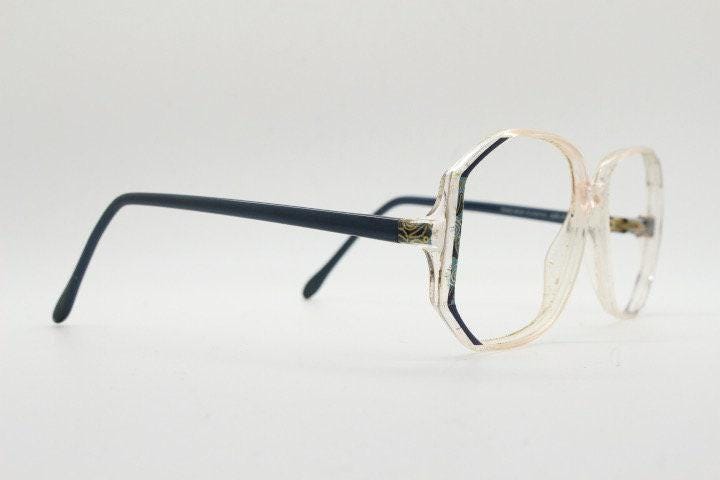 Silhouette 80s vintage hexagon eye glasses made in Austria. Transparent crystal optical frame with abstract blue pattern. Prescription. 70s