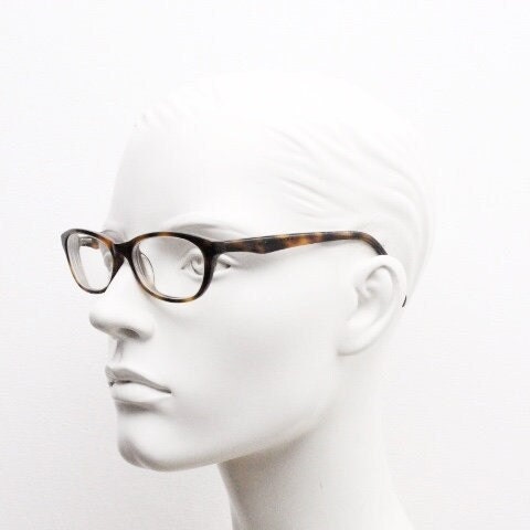 Calvin Klein Jeans modified cat eye glasses model CKJ918. Tortoise gloss low profile acetate optical frames. Prescription eyeglasses. RX
