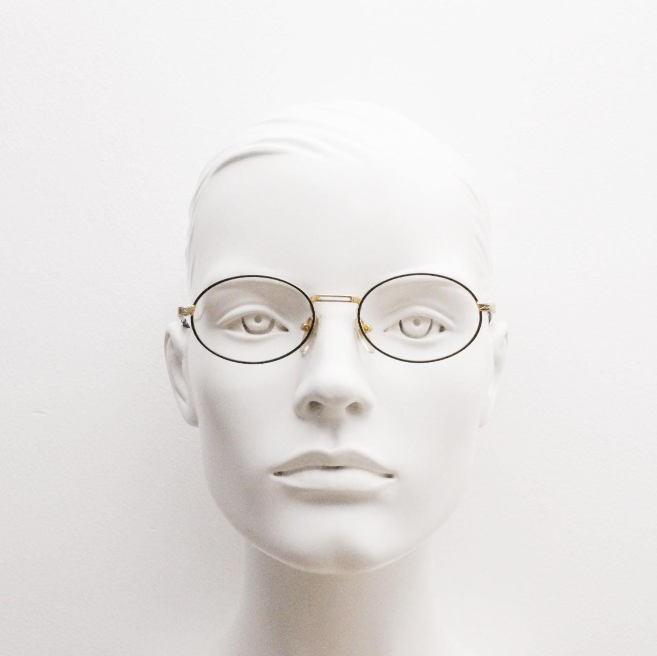 90s vintage small oval eye glasses. Gold and black optical frames with ornate arm details. Prescription RX steampunk spectacles. NOS