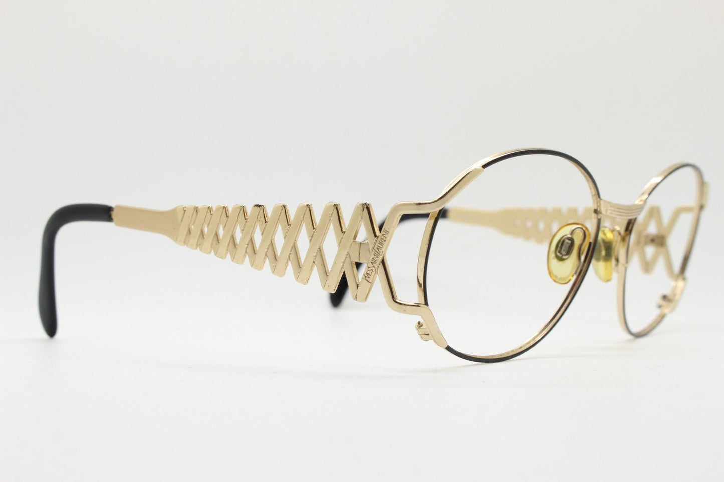 Yves Saint laurent 90s vintage large oval eye glasses made in Italy with incredible zig zag arm design. YSL Prescription RX spectacles