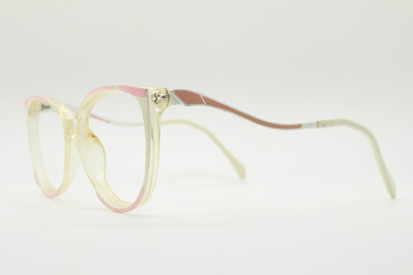 May include: Vintage spectacles with a clear frame, featuring pink and brown accents. The glasses have a rectangular shape and a light-coloured temple arm. The overall design is retro and stylish.