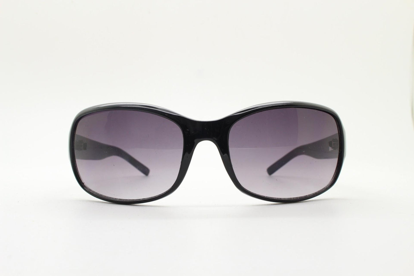 Y2K vintage curved wraparound sunglasses. Aerodynamic plain black gloss curved wrap frame. Minimal shield design. NOS