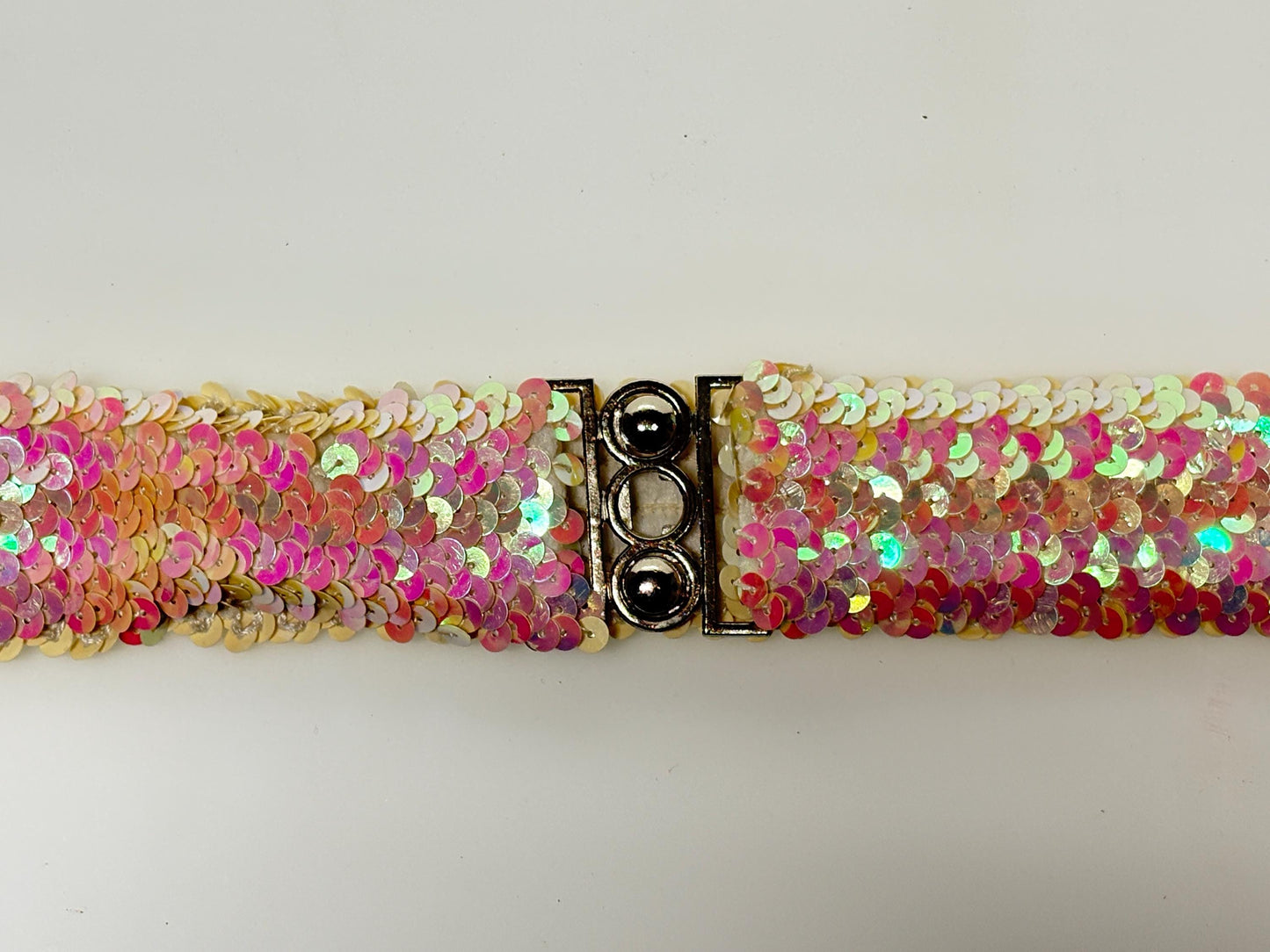 70s vintage womens elastic pink and white sequin stretch belt with chrome circles buckle. To wear with a dress. Authentic disco belt