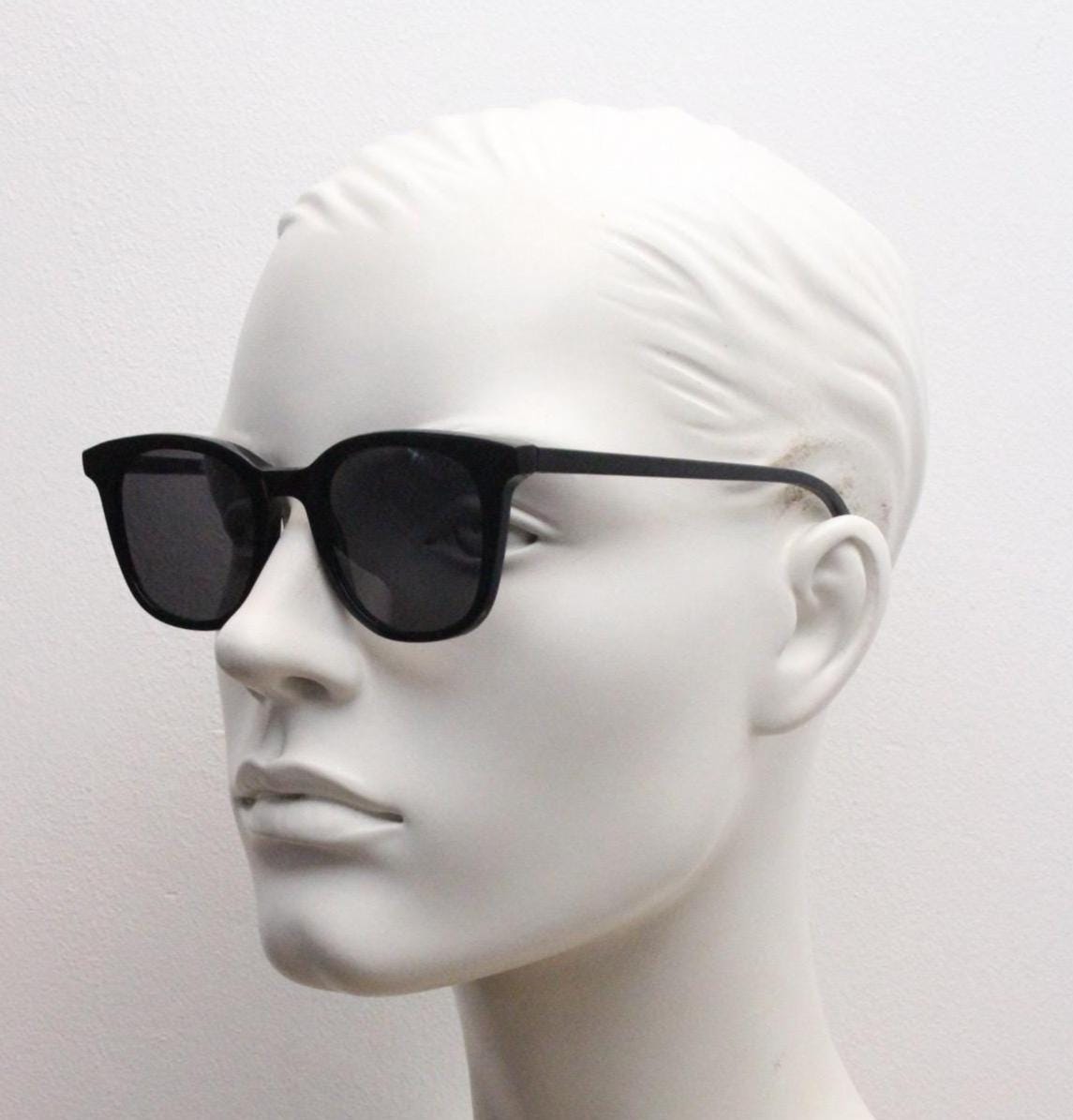 Vintage 90s slim frame black horn rim sunglasses. All time classic retro refined wayfarer design in gloss with black lenses