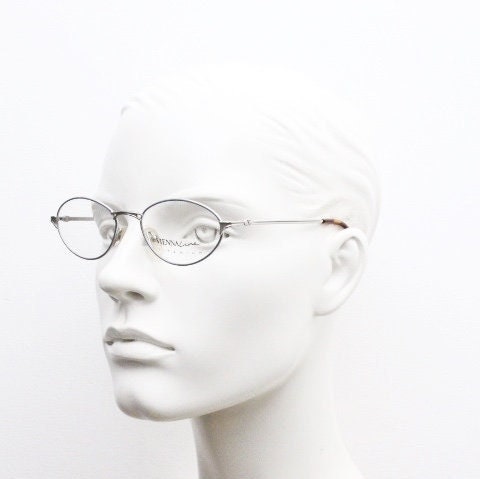 Viennaline 90s vintage oval eye glasses made in italy from titanium. Satin silver optical frame with grey enamel outline. Prescription RX