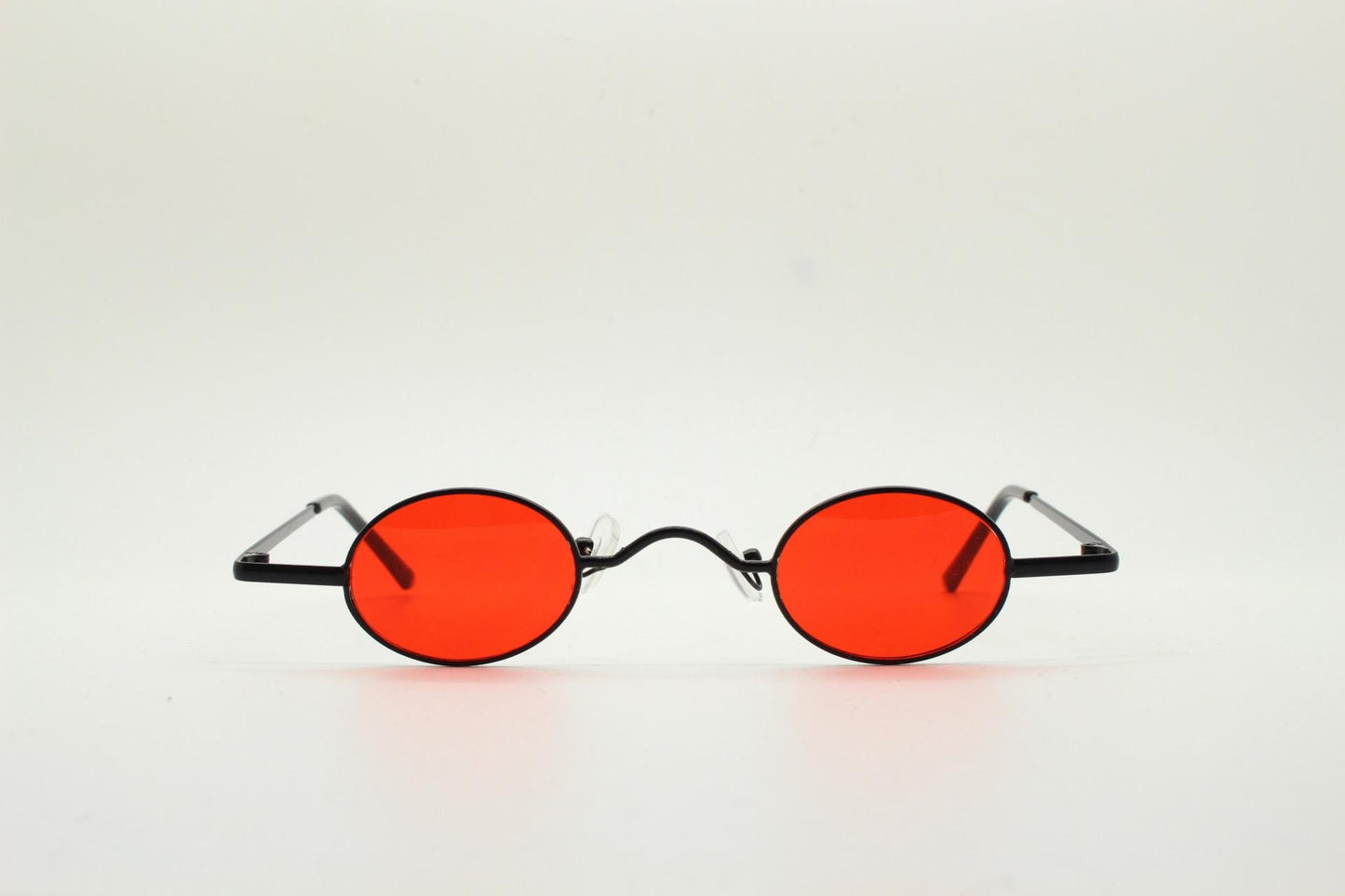 90s vintage small oval sunglasses. Imposing minimal black gloss metal victorian antique style frame with bright red lenses. Steampunk. NOS