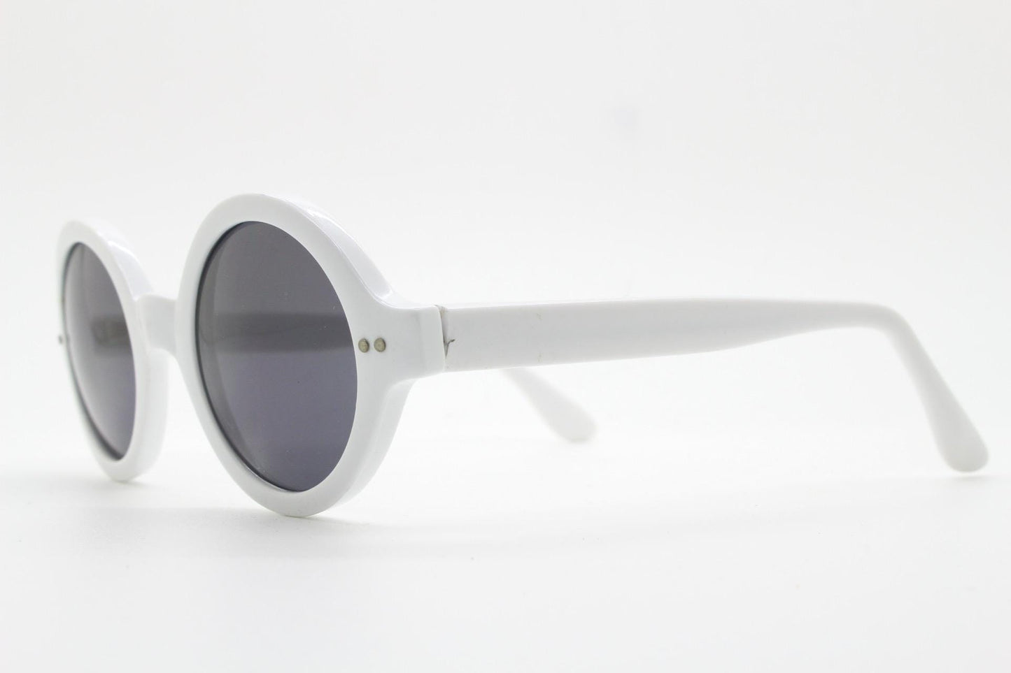 90s vintage round monochrome sunglasses. 30s design in an ice white frame with plain black lenses. Quality construction unused NOS