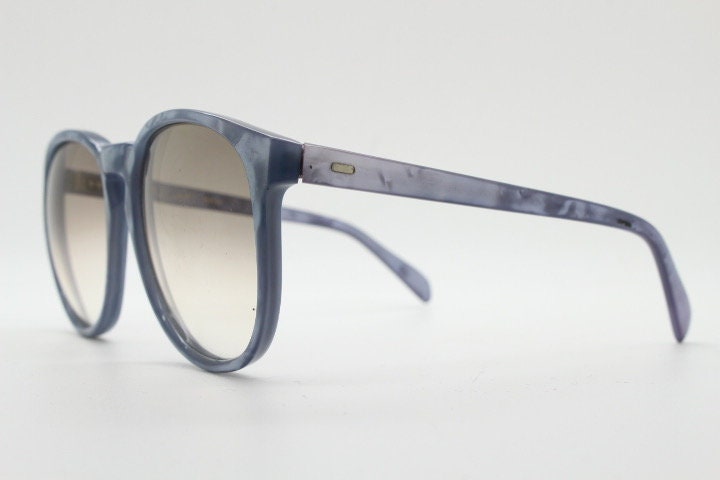 Michele L'Amy 80s vintage round sunglasses made in France. Lustrous marbled blue frame with keyhole bridge and graduating brown lenses