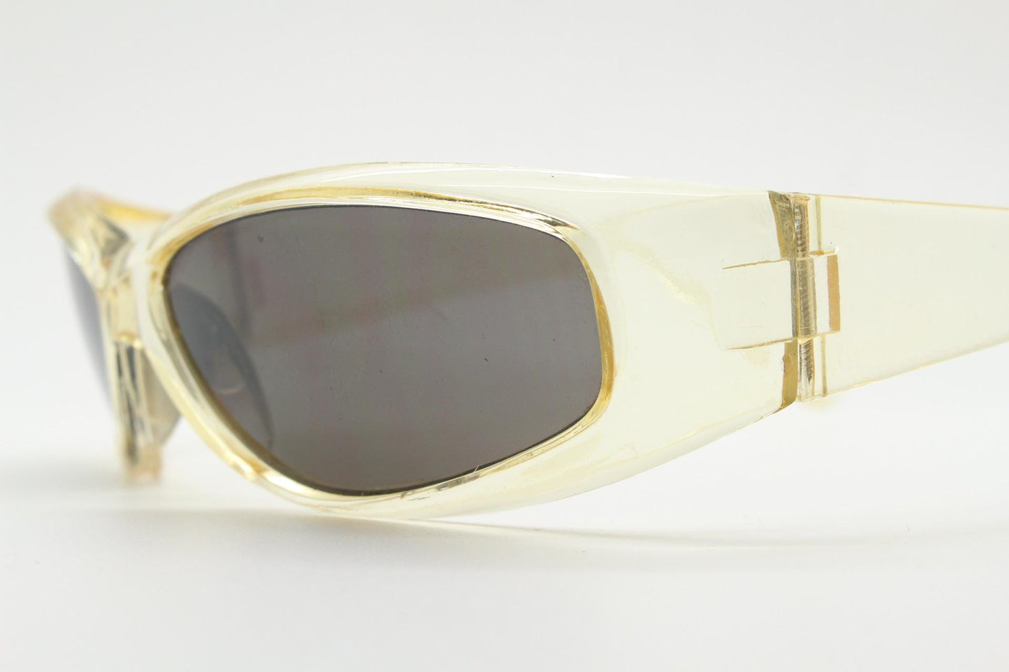 90s vintage sports shield sunglasses. Transparent yellow aerodynamic curved wraparound frame with contrasting black lenses. 2000's rave