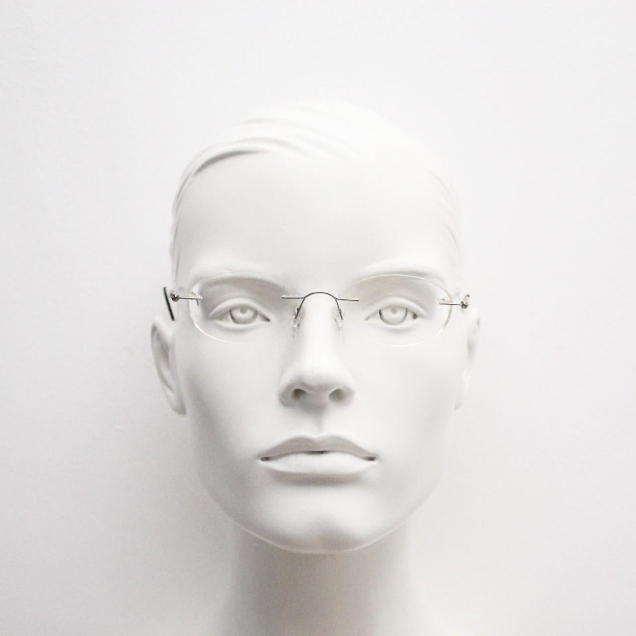 Silhouette vintage oval frameless eye glasses made in Austria. Minimal lightweight brown chrome optical frame. Prescription spectacles