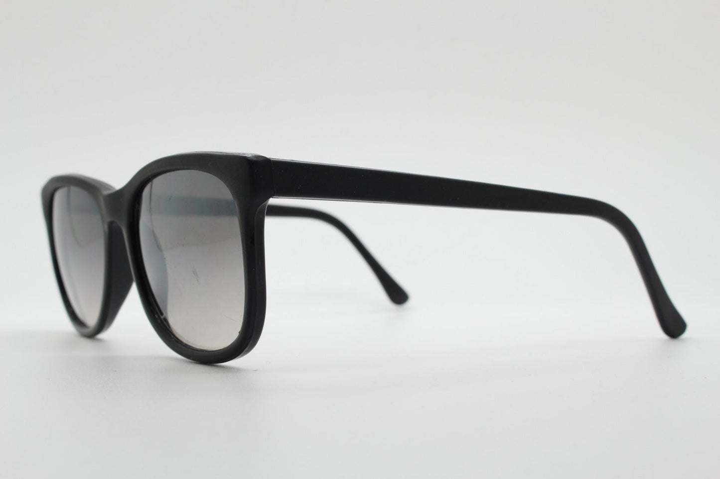 Vintage 80s thick frame black square sunglasses. All time classic design in matt and gloss combo with slight mirror glaze lenses. NOS
