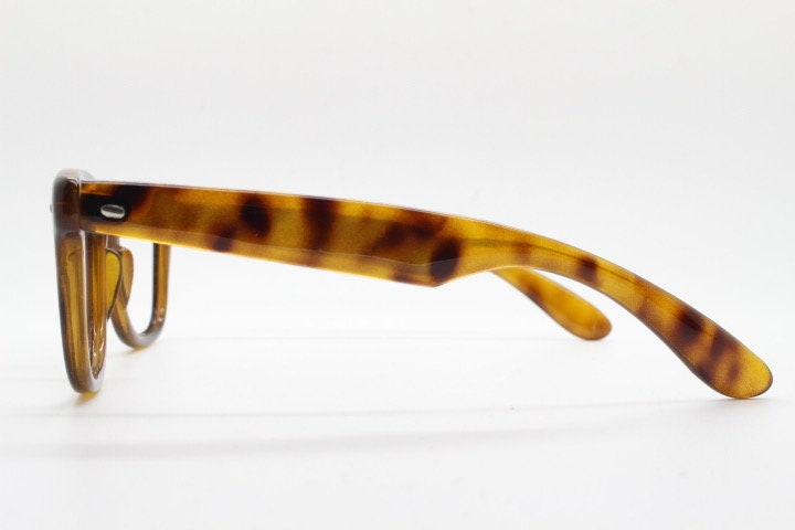 90s vintage wayfarer design eye glasses made in Italy. All time classic optical frames in mottled browns. Prescription RX eyeglasses. NOS