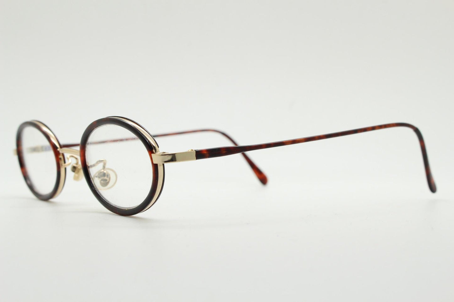 90s vintage small oval eye glasses. Gold metal frame 20s design optical frames with tortoise inserts and arms. Prescription. Spectacles NOS