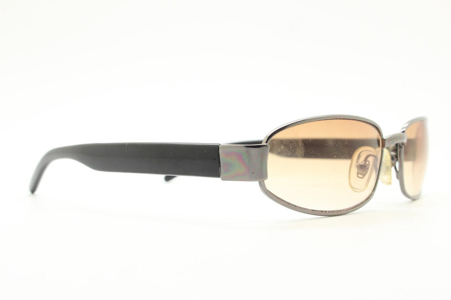90s vintage oval sunglasses small bug eye with light tone lenses. Satin finish brown metal frame with black arms. 2000's. NOS