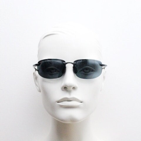 Maui Jim sport wrap around sunglasses made in Japan. Lightweight half frame shield with curving lenses. 2000's. Y2K