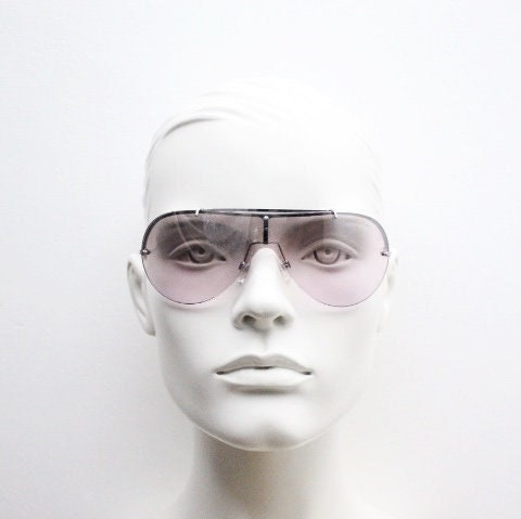 Y2K vintage visor shield sunglasses. Silver chrome half frame with pink wraparound mono lens and mirror glaze. Mini mask. 00's. 2000's NOS