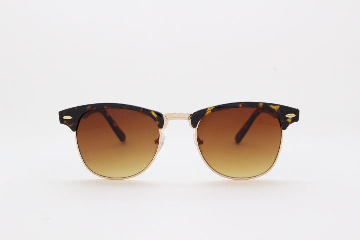 90s vintage browline sunglasses. All time classic design in tortoise gloss with gold half rim. 50s, 60s. Unused NOS