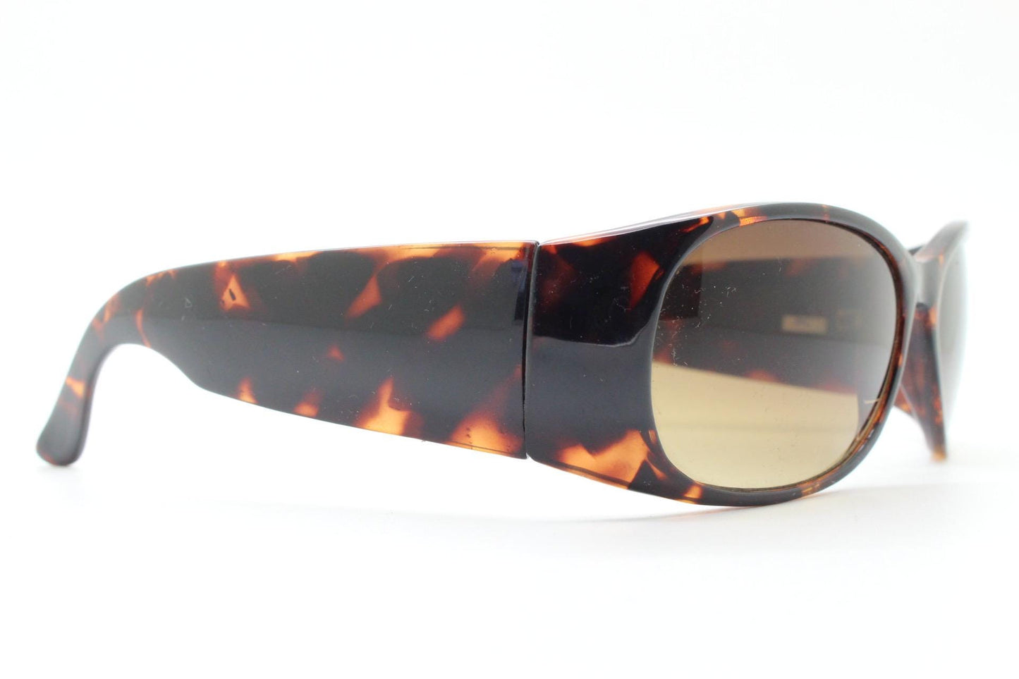Y2k vintage wrap around bug eye sunglasses. Aerodynamic 60s design tortoise frame with full height arms in excellent proportions. 2000's NOS