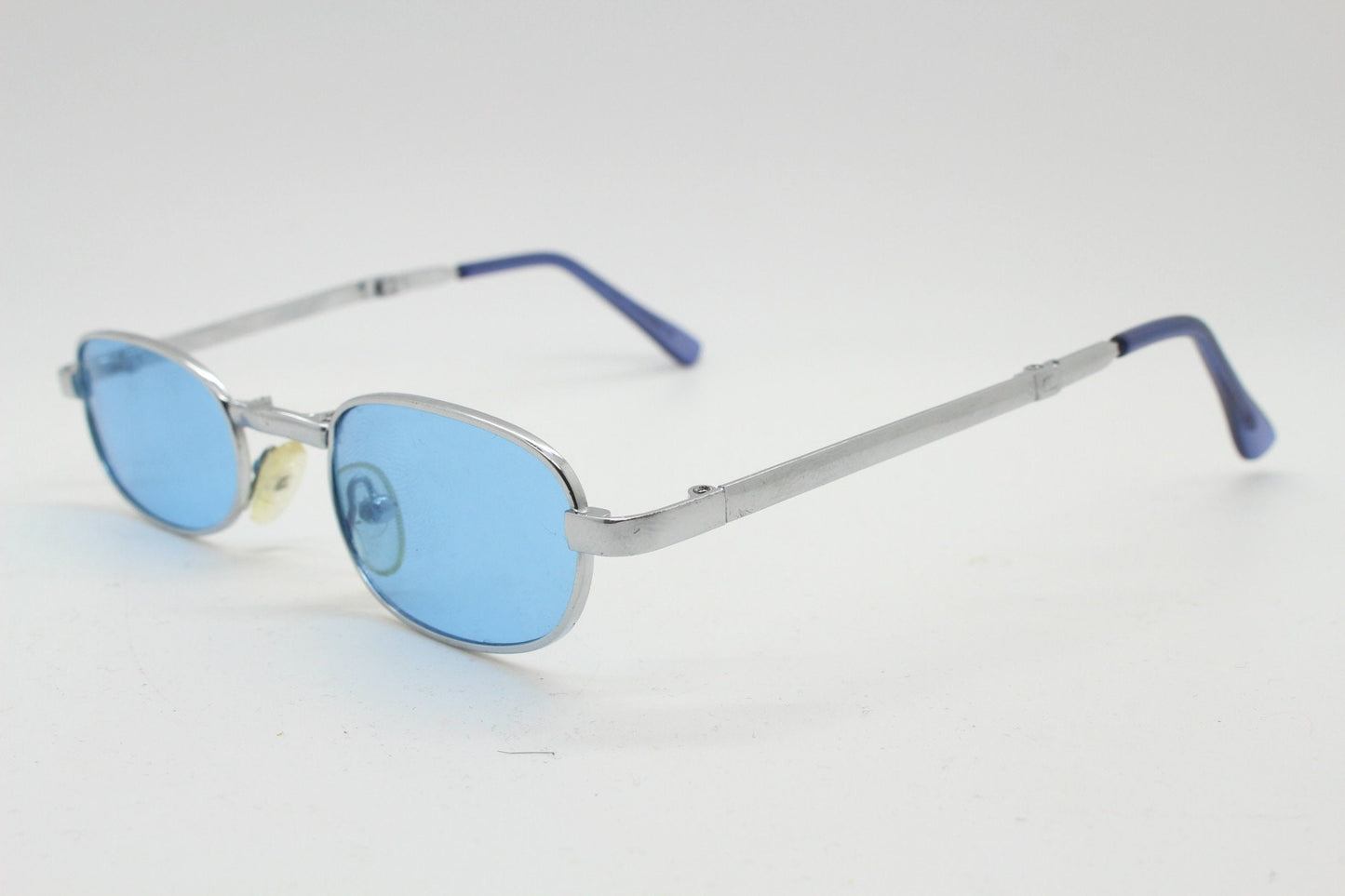 90s micro foldable oval sunglasses. Sky blue lenses in a small silver folding compact frame. Folder. Rave 2000s. Y2K. NOS