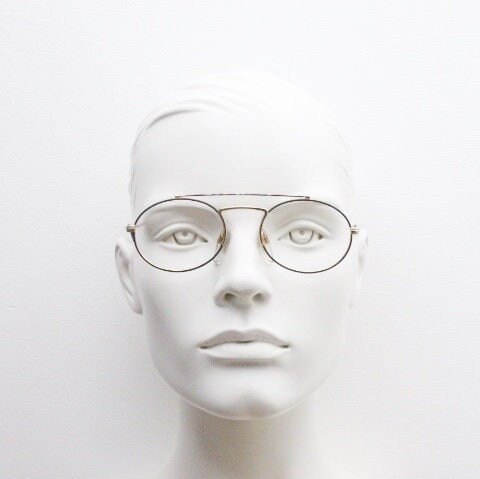 90s vintage oval eye glasses. Gold metal optical frame with vibrant enamel pattern and prominent double bridge. Prescription spectacles. NOS