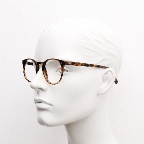 Cubitts vintage round 40s design hand made eye glasses. Honey tortoise acetate optical frame with keyhole bridge. Prescription RX