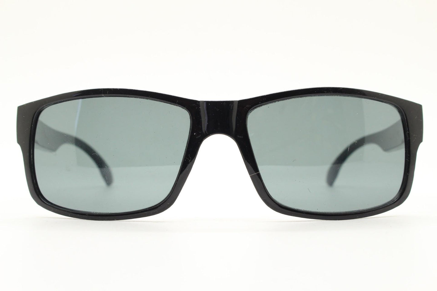 Y2K vintage sharp rectangular sunglasses. Large curved black gloss frame with dark green lenses and silver arrow arm crests. NOS