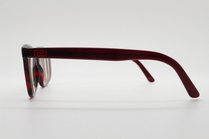 Versace modified wayfarer design eye glasses made in Italy. Mottled brown acetate optical frames with subtle logo. Prescription eyeglasses