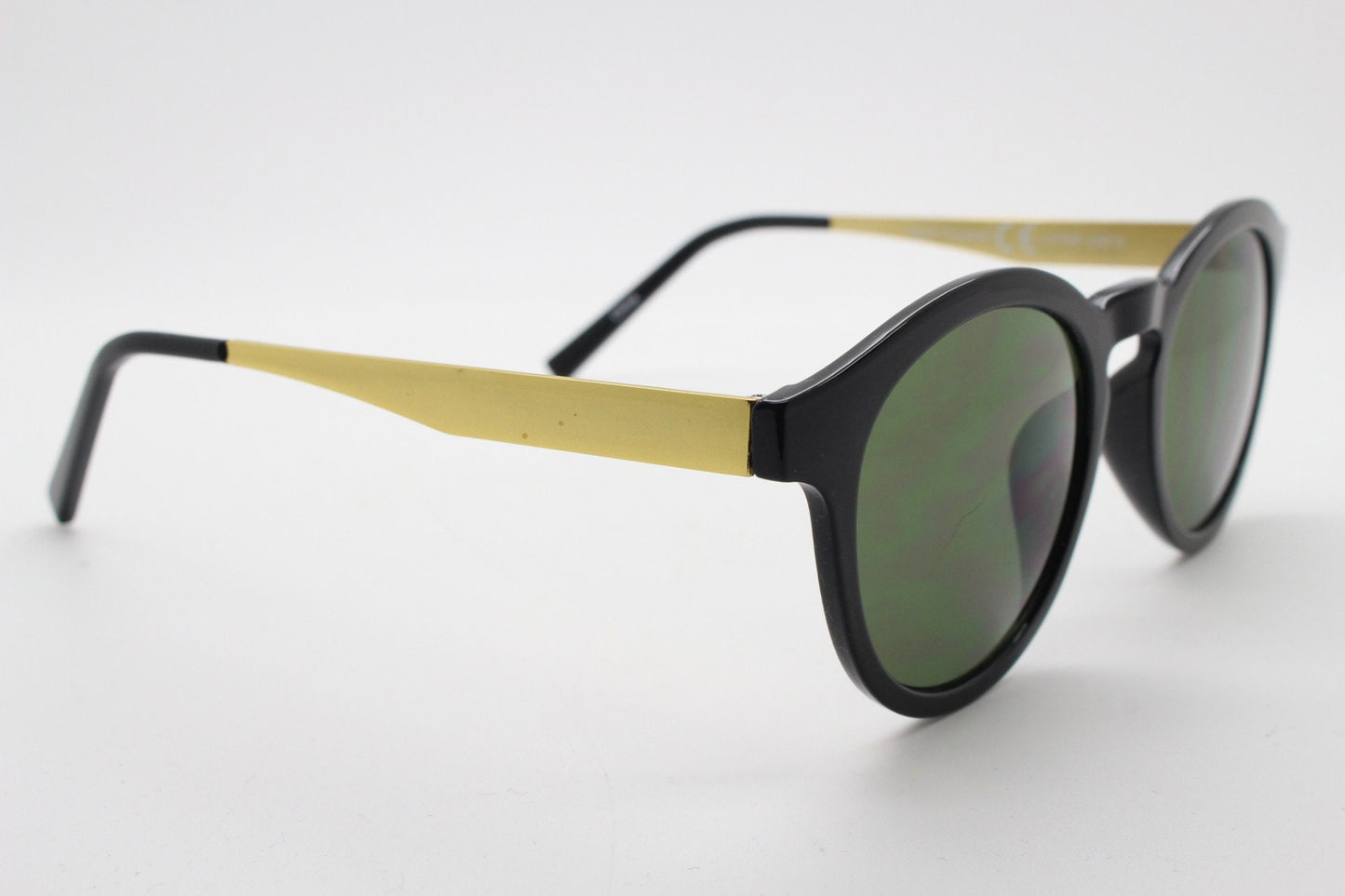 90s vintage round sunglasses. Black gloss frame with contrasting gold arms