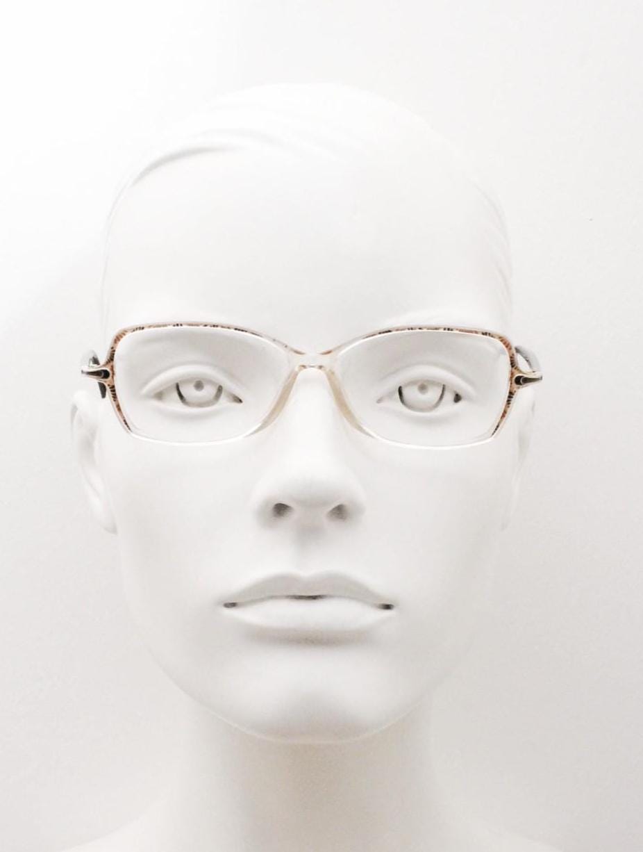 Silhouette 80s vintage oval eye glasses made in Austria. Transparent crystal optical frame with giraffe arm print. Prescription RX