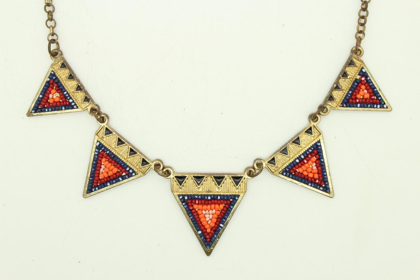 80s vintage gold triangles necklace. Aztec style with multi coloured bead inlays and ornate patterns. Womens statement design