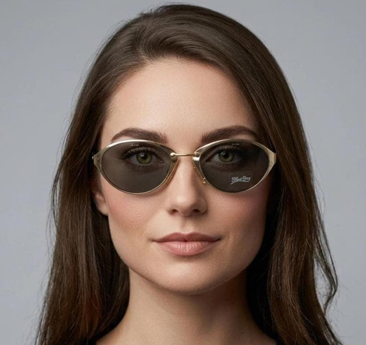 Blue Bay 90s vintage oval cat eye sunglasses made in Italy by Safilo. Dynamic gold chrome finish with contrasting dark lenses. NOS with tag