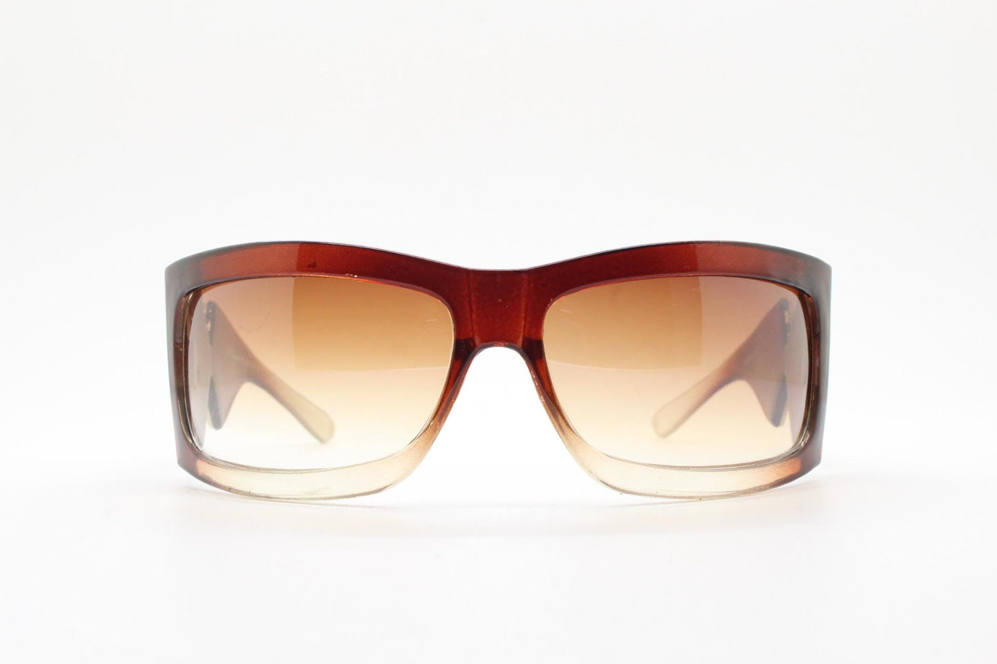 Y2K vintage big wrap around sunglasses. Transparent brown shield design with hot graduating lenses and big X crest. 2000s bug eye. NOS