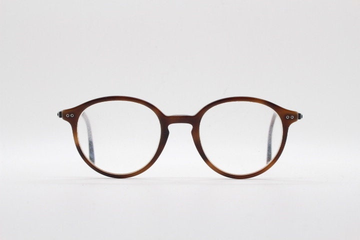 Giorgio Armani eye glasses model 7124 made in Italy. Mottled brown acetate optical frames with flat metal arms. Prescription eyeglasses. RX