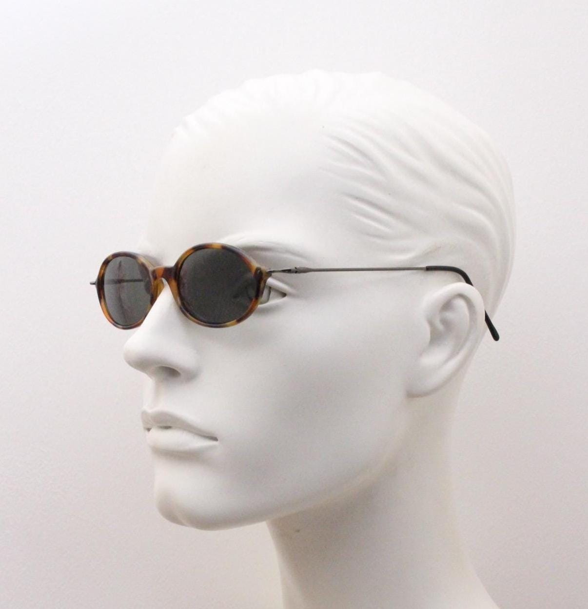90s vintage oval sunglasses. Honey tortoise frame with refined slim 'industrial tech' style arms. Micro. Unused NOS