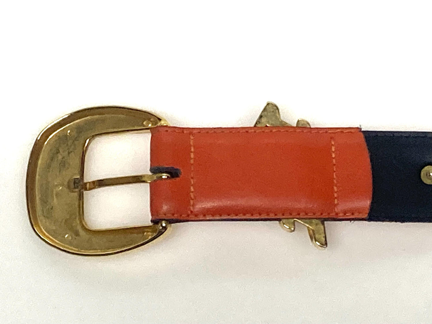 80s vintage womens dress / jeans belt in bright orange leather with golden metal squares. Made in France. Used in good condition