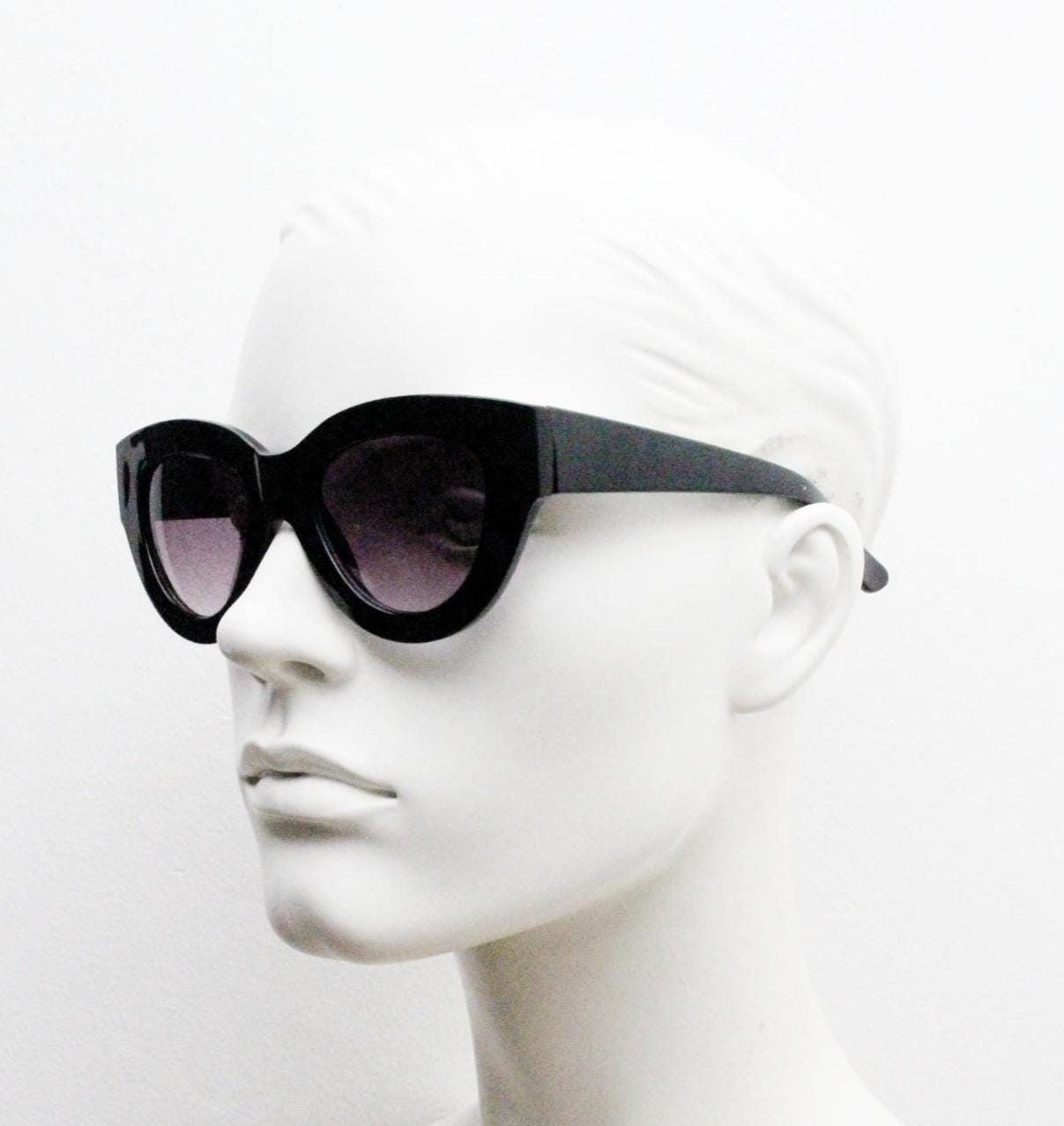 Y2K vintage thick oversized cateye sunglasses. Womens black gloss big arm cat eye frame with gradient lenses. 2000s NOS