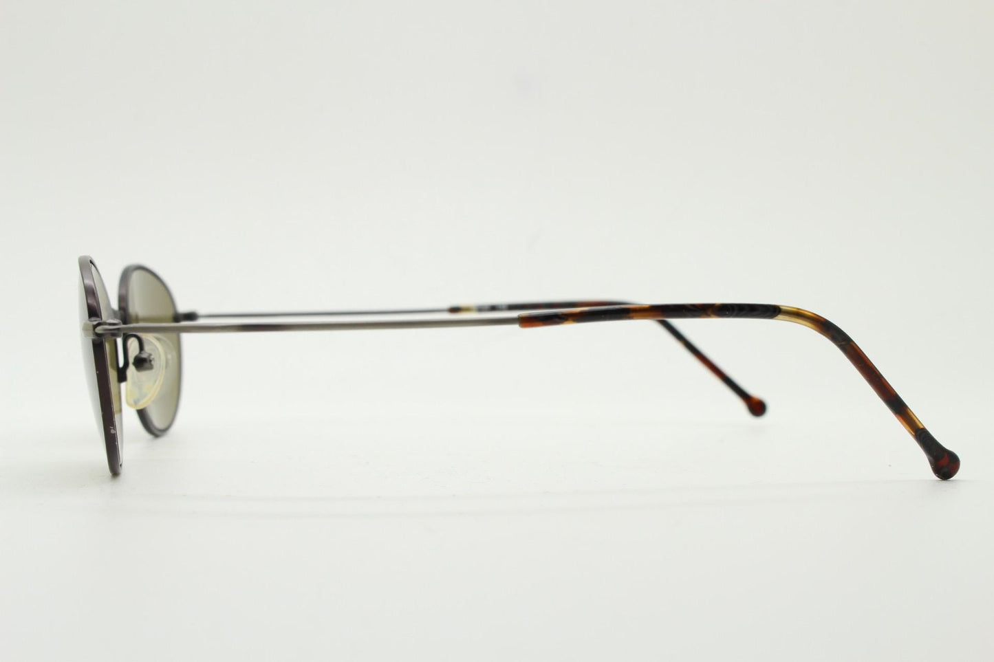 90s oval vintage metal sunglasses. Minimal satin finish bronze and brown metal frame with kinked curving arms. Steampunk. Unused NOS